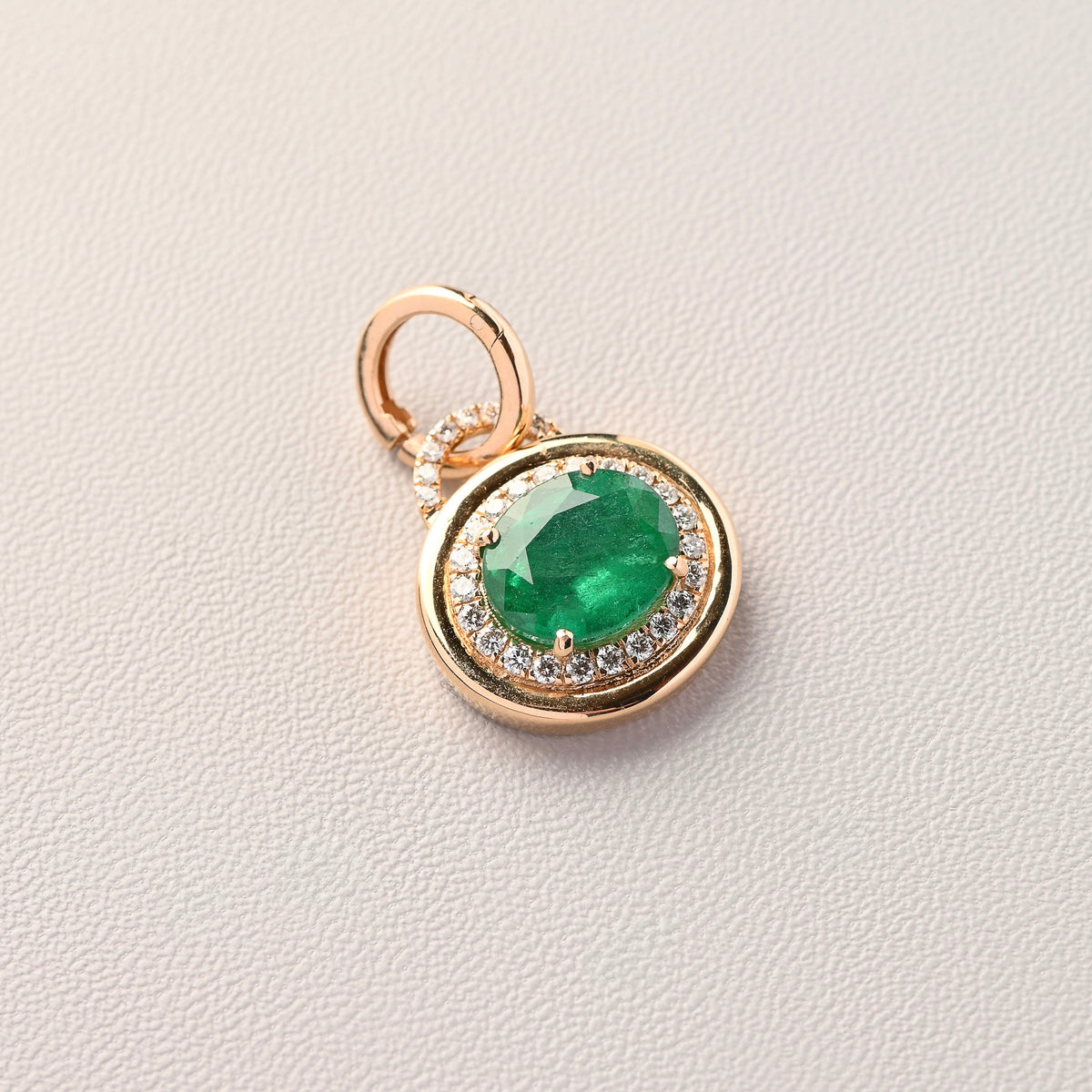 Emerald oval bezel and diamond halo Pendant